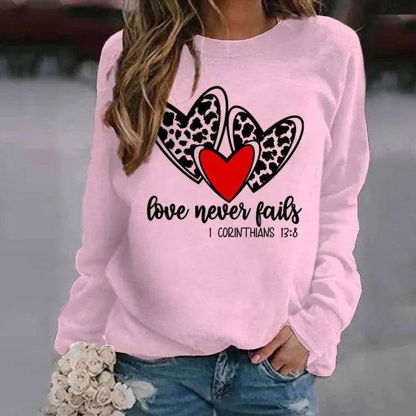 San Valentino Leopard Heart Love Never Fails Pullover stampato Moda Girocollo Top Donna Felpa senza cappuccio Felpa a maniche lunghe Autunno Casual Grafica Streetwear